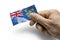 Hand holding a card with a national flag the Pitcairn Islands