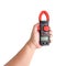 Hand holding clamp multimeter measuring. clipping paths