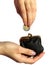 Hand holding coin and wallet