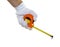 Hand holding construction measuring tape isolater on white