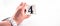 A hand holding digit number 4 four on white background