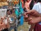 Hand holding  earrings or jhumka in a mela, traditional earring close up