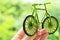 Hand Holding Eco bicycle icon concept