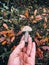 Hand holding edible mushroom with brown cap in autumn woods. Picking Brown Birch Bolete mushrooms