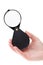 Hand holding folding magnifier loupe