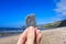 Hand holding a fossil - fossil hunting in Dorset on the Jurassic coast