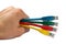 Hand Holding Four Multi Colored Network Cables