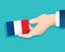 Hand holding France flag card with blue background. vector illustration eps10