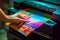 Hand holding a freshly printed photograph with vibrant colors, showcasing the high-quality output of an ink photo printer.