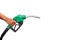 Hand holding gas nozzle with one last drop. A man holding a green gasoline nozzle on a white background.