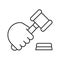Hand holding gavel linear icon