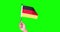Hand holding Germany flag in studio