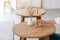 A hand holding a glass of iced coconut coffee on wooden table in minimal cafe