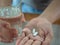 Hand holding glass of water and pills, tacking medicine concept