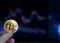 Hand holding gold coin crypto currency stock trade graph background new invest market