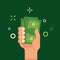 Hand holding green money flat vector illustration. Bundle of money in male hand. Income, finance, profit, salary concept