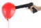 Hand holding at gunpoint a red balloon