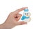 Hand holding home made snowman sugar cookie isolated