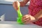 Hand holding homemade toy called Slime, kids having fun and being creative by science experiment