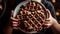 Hand holding homemade waffle stack, indulgence in sweet refreshment generated by AI