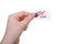Hand holding `I Voted` sticker isolated