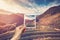 Hand holding Instant photo and view tea field sunrise.