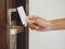 Hand Holding Key card Hotel room access