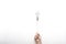 Hand holding  light bulb on rope floating on white background with texting space, idea concept