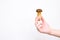 Hand Holding little Fresh Forest Mushroom On White Background