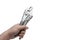 Hand holding locking pliers or vise grips on white backdrop. Automotive industry.