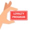 Hand holding loyalty program card