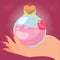 Hand holding a magical love potion elixir Vector