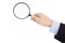 Hand holding magnifier glass