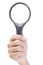 Hand holding magnifying glass