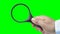 Hand holding a magnifying glass green screen