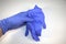 Hand holding medical surgical glove