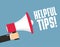 Hand holding megaphone - Helpful tips