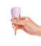 Hand holding melting sweet potato flavor ice cream cone with chocolate on white with clipping path