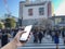 Hand holding mobile smart phone with a crowd of people in Shibuya Crossing