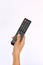 Hand holding Multimedia remote control on white background