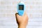 Hand holding non contact infrared thermometer for measure a body temperature. Healthcare and medical theme