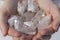 A hand holding a pile of quartz