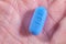 Hand holding Pill used for HIV PreP