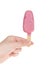 Hand holding pink cake popsicle isolated on white background