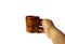 Hand holding a porcelain cup with Guatemalan coffee on white background. drink concept