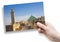 Hand holding an postcard about the most important religious complex of the medieval medina of Fes with the Zawiya of Moulay Idriss