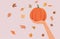Hand Holding Pumpkin Celebrating Autumn Season Vector Cartoon Illustration