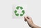Hand holding recycle symbol isolated on white background. eco