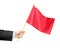 Hand holding a red flag