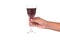 Hand holding red wine in crystal glass ready to toast